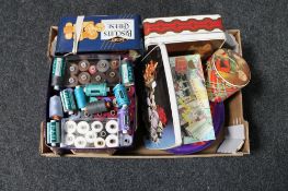 A box of tins and boxes of thread and buttons