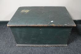 An antique pine painted blanket box