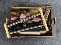 A box of musical instruments to include xylophone, tambourine, drum sticks,