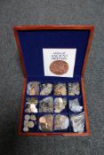 A wooden box containing a large quantity of pre decimal British coins, Foreign coins,