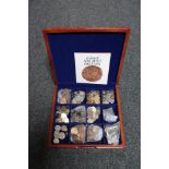 A wooden box containing a large quantity of pre decimal British coins, Foreign coins,