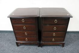 A pair of Stag four drawer bedside chests