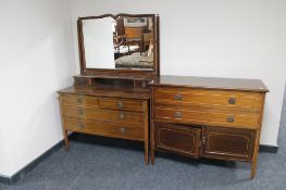 A three piece late Victorian inlaid mahogany bedroom suite; mirrored wardrobe,