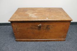 An antique pine blanket box with key