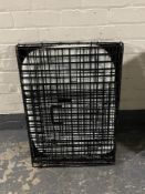 A folding wire mesh dog cage