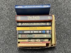 A box of ten Folio Society volumes, Travels with a Donkey, The Earth; An Intimate History,