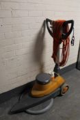 A Taski 1200 industrial floor buffer