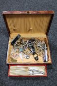 A box of costume jewellery, nut crackers, lady's and gent's wristwatches including Pierre Cardin,