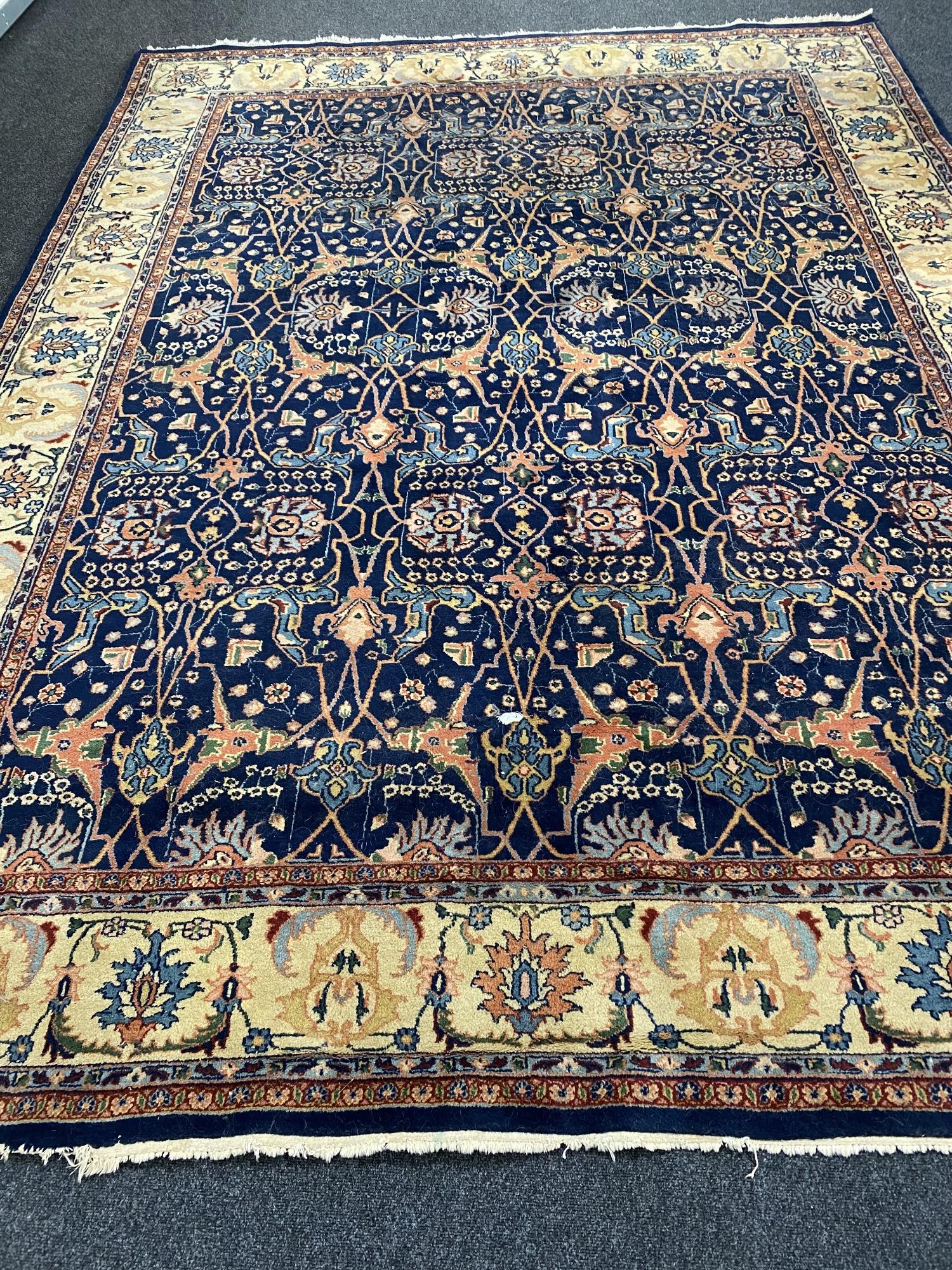 A fringed woolen Persian design carpet (losses)