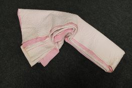 An antique hand stitched Durham quilt (pink)