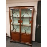 A late Victorian inlaid mahogany display cabinet,