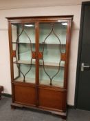 A late Victorian inlaid mahogany display cabinet,