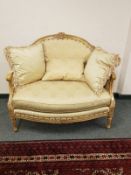 A French style two seater chair with scatter cushions,