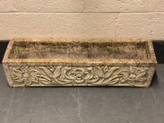 A concrete garden trough, length 98 cm.