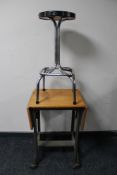An early 20th century flap sided bed table on metal castors together with a mid century tubular