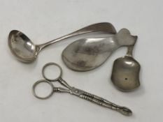 A silver ladle, two caddy spoons,