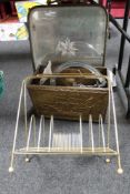 A brass framed etched mirrored fire screen together with a brass embossed magazine rack,