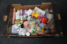 A box of collection of soaps and Avon cosmetics