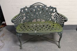 A cast metal Victorian style garden bench