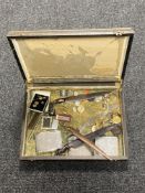 A box containing costume jewellery, paper knives, wristwatches,