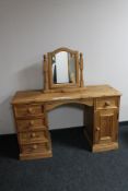 A striped pine kneehole dressing table with dressing table mirror