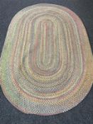 An oval woolen chain stitched rug