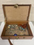 A jewellery box containing various silver and white metal jewellery, necklaces, earrings,