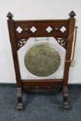 A Victorian brass dinner gong on stand with beater CONDITION REPORT: 100cm high by