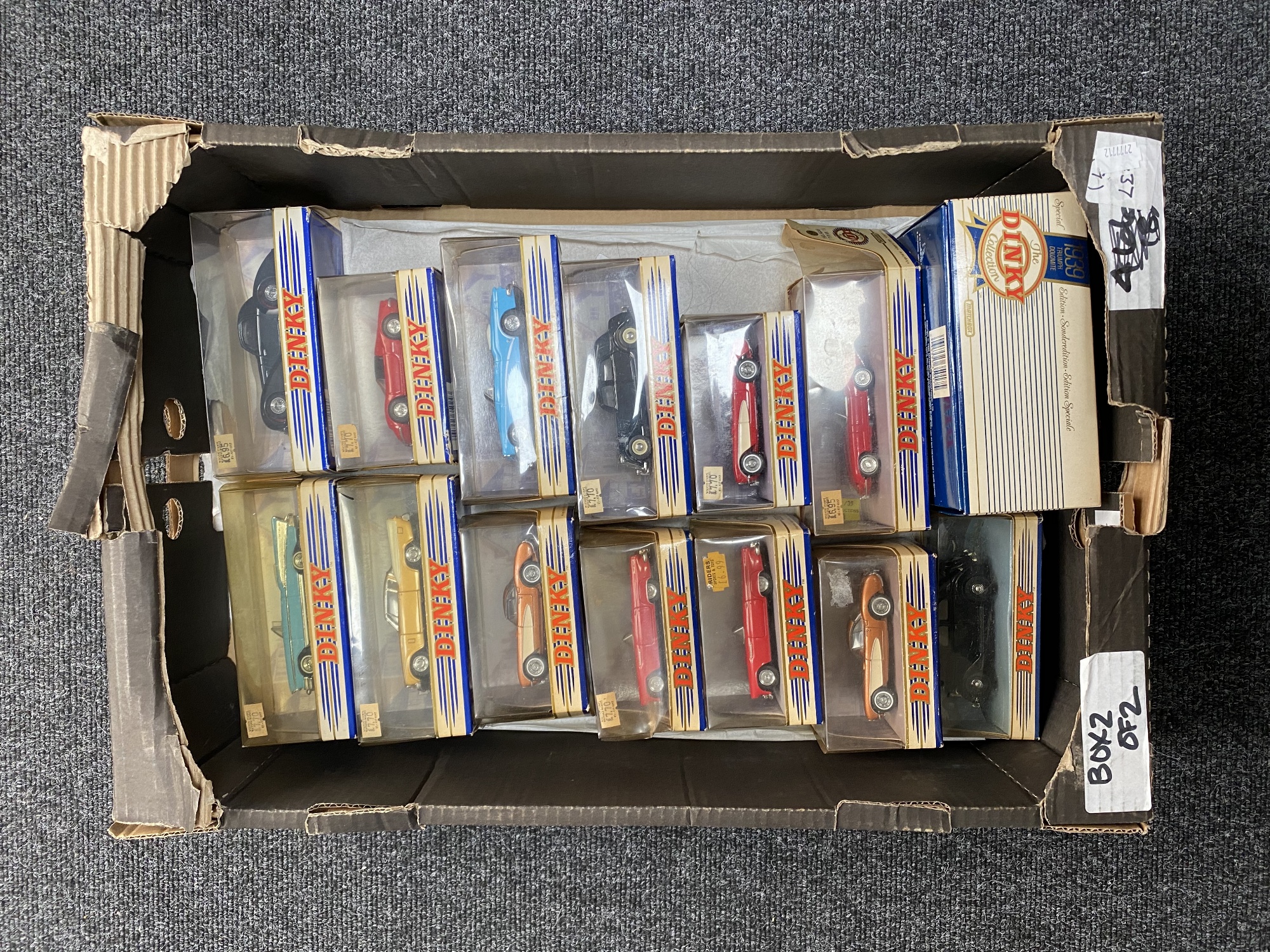 A box of fourteen boxed 20th century Dinky die cast cars