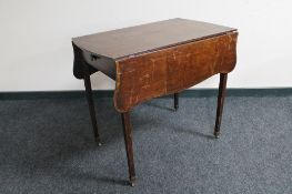 A Victorian inlaid mahogany Pembroke table