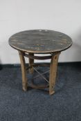 A contemporary barrel lidded occasional table