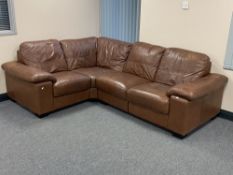 A brown leather four seater corner settee