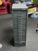 A fifteen drawer metal index cabinet