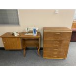 A mid 20th century teak seven drawer chest and New Home electric sewing machine in teak cabinet
