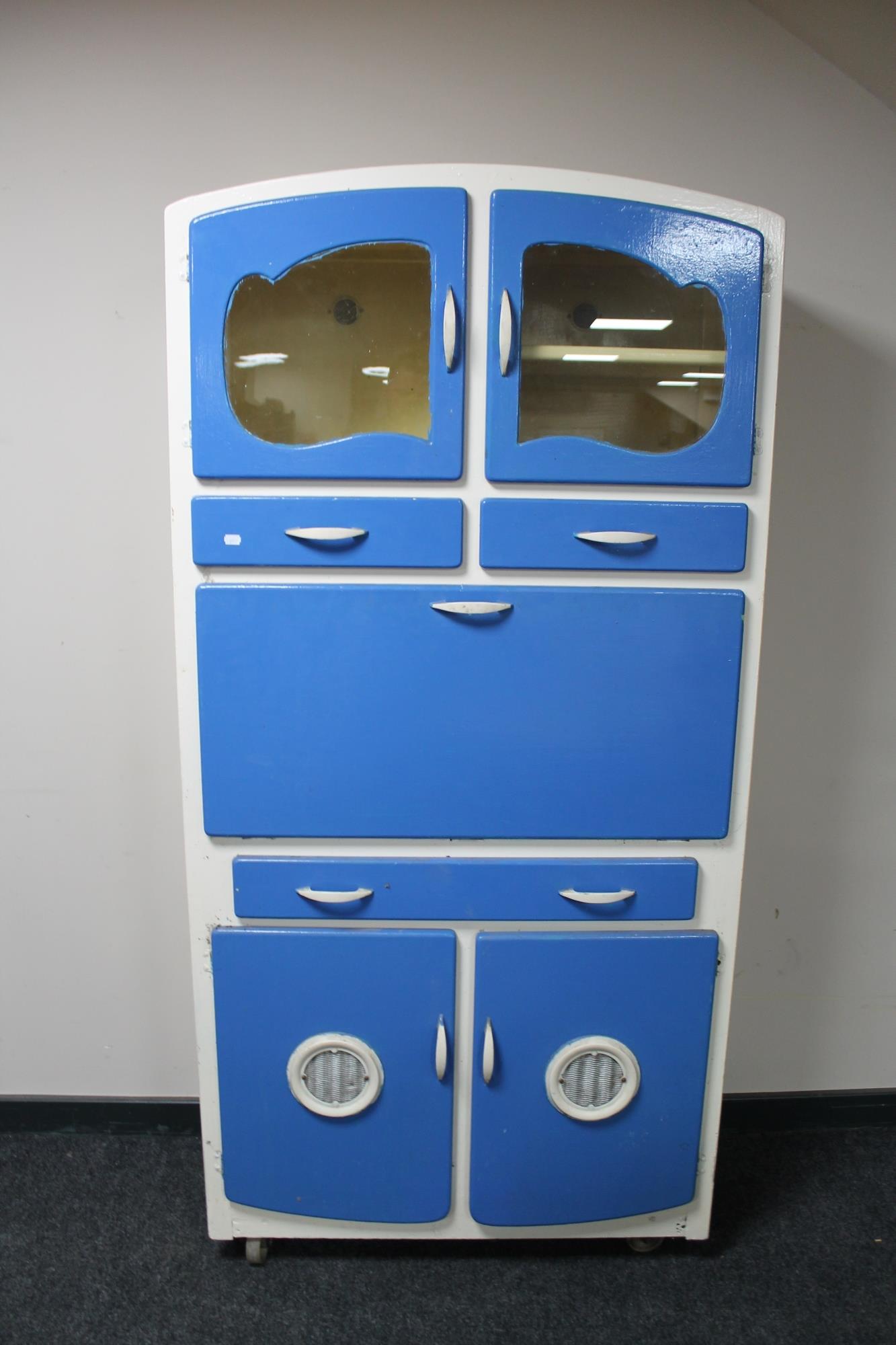 A mid century painted kitchen cabinet