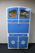 A mid century painted kitchen cabinet