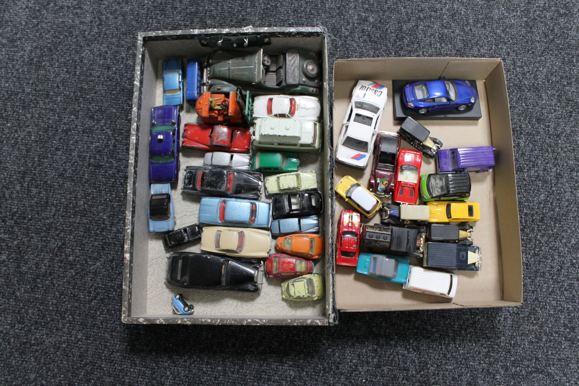 Two boxes of mid 20th century and later play-worn die cast cars,