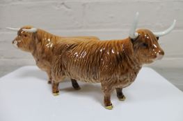 A Beswick Highland bull together with a Highland cow (bull a/f)