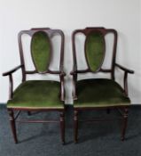 A pair of late 20th century stained beech framed armchairs in green dralon
