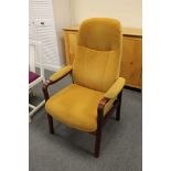 A late 20th century stained beech manual reclining armchair