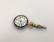 An enamelled fob watch upon a gold catch