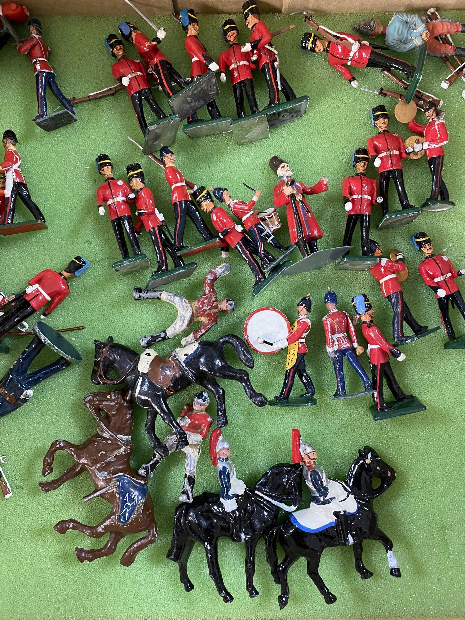 A box of vintage hand painted lead figures,