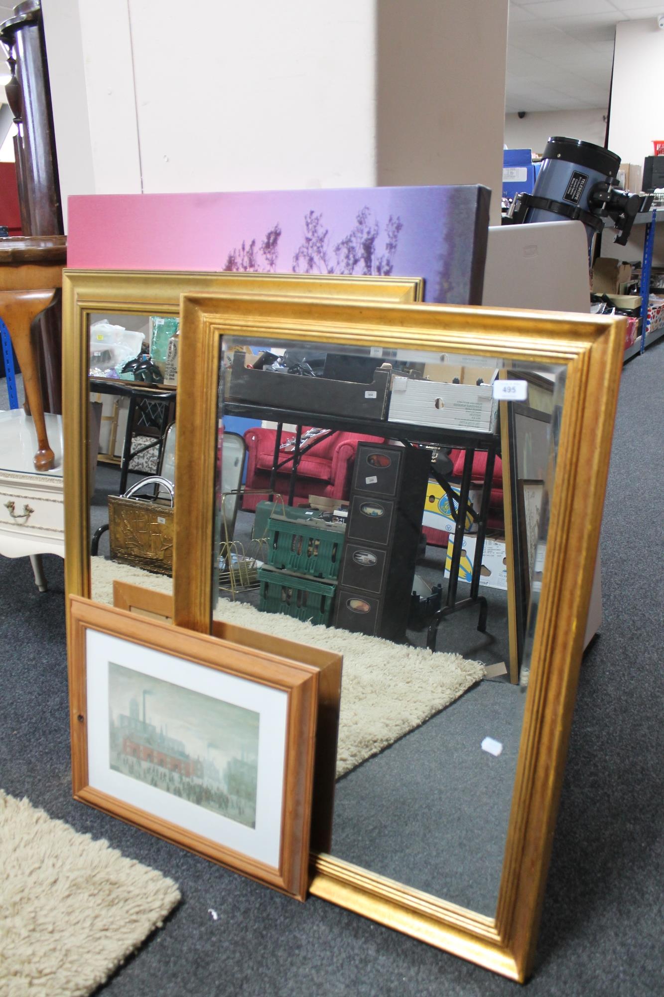 Two gilt framed mirrors together with a wall canvas - rural scene and a framed L S Lowry print