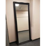 A traditional style black framed mirror,