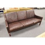 A mid 20th century Danish brown leather three seater settee