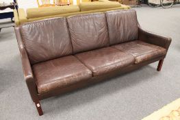 A mid 20th century Danish brown leather three seater settee