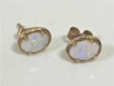 A pair of 9ct gold opal stud earrings