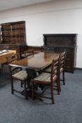 A six piece Ercol elm dining room suite comprising refectory table,