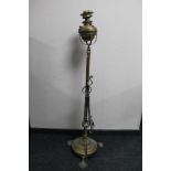 An Art Nouveau brass standard lamp