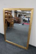 A contemporary gilt framed overmantel mirror.
